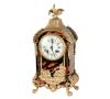 <span class='ref_item'>156 -</span> <span class="object_title">RELOJ  DE SOBREMESA TIPO BOULLE, CUERDA - LLAVE</span>   <p><span class="technical_description">Esfera de porcelana blanca con números romanos para horas y árabes para los minutos. Mecanismo de cuerda por llave. Toda la caja rematada en latón dorado con figura de Neptuno en la parte inferior y en la superior copete que culmina con motivo de ave. En funcionamiento.<br/>29,5 x 14 x 7,5 cm</span><br></p>