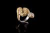 <span class='ref_item'>62 -</span>  <span class="object_title">SORTIJA SERPIENTE DE PLATA CON ZAFIROS Y CIRCONITAS</span><br><span class="technical_description">Realizada en plata bañada en oro blanco de 18kt. Con forma de serpiente enroscada cuajada de zafiros amarillos, peso total aproximado: 7.05ct. y cabeza de circonitas. </span>  