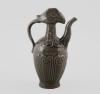 <span class='ref_item'>10 -</span> <span class="object_title">JARRA VOTIVA. SIGUIENDO MODELOS DE LA DINASTÍA SONG. CHINA</span> <span class="technique_material">Porcelana vidriada</span> <span class="ALTO_HCES1">19 </span><span class="ALTOUMED_HCES1">cm.</span>  <p><span class="object_title">JARRA VOTIVA. SIGUIENDO MODELOS DE LA DINASTÍA SONG. CHINA</span><br><span class="technique_material">Porcelana vidriada</span><br><span class="technical_description">Representando una tetera realizada en cerámica vidriada en tonalidad verdosa conocida como celadón.<br/>Con decoración incisa. Tapa en forma de cabeza de gallo unida al cuerpo mediante un cuello cilíndrico, junto con dos pequeñas asas laterales en el cuerpo.<br/>Buen estado de conservación, pequeña rotura en la boca de la vertedera.</span><br><span class="ALTO_HCES1">19 </span><span class="ALTOUMED_HCES1">cm.</span></p>