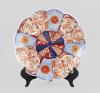 <span class='ref_item'>36 -</span> <span class="object_title">PLATO IMARI, JAPÓN, FF. S. XIX</span> <span class="technique_material">Porcelana</span> <span class="ALTO_HCES1">5,50</span>x<span class="ANCHO_HCES1">30 </span><span class="ANCHOUMED_HCES1">cm.</span>  <p><span class="object_title">PLATO IMARI, JAPÓN, FF. S. XIX</span><br><span class="technique_material">Porcelana</span><br><span class="technical_description">Decoración compartimentada con motivos florales y de perfil gallonado.</span><br><span class="ALTO_HCES1">5,50</span>x<span class="ANCHO_HCES1">30 </span><span class="ANCHOUMED_HCES1">cm.</span></p>