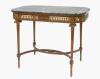 <span class='ref_item'>248 -</span> <span class="object_title">MESA ESTILO LUIS XVI DE MADERA TALLADA CON APLICACIONES DE BRONCE DORADO.FFS.S.XIX</span>   <p><span class="technical_description">Patas en forma de columnas acanaladas con aplicaciones de bronce y chambrana en x. <br/>Sobre de mármol verde con faldón recortado y aplicaciones de bronce dorado de triunfos. <br/>79 x 58 x 100 cm. </span><br></p>