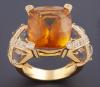 <span class='ref_item'>14 -</span>  <span class="object_title">SORTIJA ANCHA REALIZADA EN ORO 18 KT CON TOPACIO Y DIAMANTES</span><br><span class="technical_description">sortija de coctel realizada en oro de 18 kt con gran topacio central talla rectangular facetada adornado con diamantes empastados en granode aprox 0.75 ct </span>  