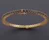 <span class='ref_item'>79 -</span> <span class="object_title">PULSERA RIGIDA REALIZADA EN ORO DE 18 KT CON ZAFIROS </span>  <p><span class="technical_description">pulsera rigida realizada en oro de 18 kt compuesta por aprox 3 ct de zafiros </span><br>Peso: <span class="PESO_HCES1">18,10</span> <span class="PESOUMED_HCES1">gr.</span><br></p>