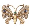 <span class='ref_item'>271 -</span> <span class="object_title">BROCHE EN ORO 18KT, ESMERALDA, ZAFIROS, RUBÍES Y DIAMANTES</span>  <p><span class="technical_description">Broche realizado en oro de 18kt. En forma de mariposa, cuajado de diamantes en talla brillante con peso total aprox 1.32ct. En las alas dos zafiros en talla redonda con peso total aprox 0.26ct, antenas rematadas con dos rubíes en talla redonda con peso total aprox 0.02ct, y esmeralda central en talla redonda con peso aprox 0.07ct.<br/>Cierre: Aguja con canutillo<br/>Medidas: 3,5 x 2,5cm</span><br>Peso: <span class="PESO_HCES1">11</span> <span class="PESOUMED_HCES1">gr.</span><br></p>