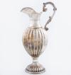 <span class='ref_item'>300 -</span> <span class="object_title">JARRO DE PLATA DE LEY </span>  <p><span class="technical_description">Jarro de plata de cuerpo globular con decoración gallonada y asa con motivos vegetales. <br/>Con costrastes en la base. <br/> </span><br>Peso: <span class="PESO_HCES1">704,50</span> <span class="PESOUMED_HCES1">gr.</span><br></p>
