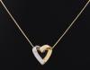 <span class='ref_item'>6 -</span> <span class="object_title">COLGANTE EN ORO BICOLOR DE 18 KT. </span>  <p><span class="technical_description">Colgante realizado en oro bicolor 18 kt en forma de corazón, una mitad cuajada de brillantes. Con cadena de plata chapada en oro. <br/>Peso aproximado de los brillantes: 0.37 ct. </span><br>Peso: <span class="PESO_HCES1">5,40</span> <span class="PESOUMED_HCES1">gr.</span><br></p>