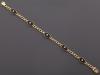 <span class='ref_item'>27.1 -</span>  <span class="object_title">PULSERA REALIZADA EN ORO DE 18 KT CON ONIX Y DIAMANTES </span><br><span class="technical_description">Pulsera realizada en oro de 18 kt de eslabón barbado con motivos en onix con centro de diamantes en talla brillante con peso total aprox 0.20 ct. </span>  