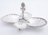 <span class='ref_item'>289 -</span> <span class="object_title">ALMENDRERO EN PLATA DE LEY </span>  <p><span class="technical_description">Almendrero realizado en plata de ley con cuatro recipientes en forma de venera y remate superior en forma de cesto florido con dos cisnes. </span><br>Peso: <span class="PESO_HCES1">157,80</span> <span class="PESOUMED_HCES1">gr.</span><br></p>