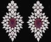 <span class='ref_item'>126 -</span>  <span class="object_title">ESPECTACULAR PENDIENTES DE ORO DE 18 KT. ESTILO "HOLLYWOOD" CUAJADOS DE DIAMANTES Y CON CENTROS DE RUBELITA OVAL.</span><br><span class="technical_description">Pendientes en oro de 18 kt. formando una cascada de diamantes en talla perilla y brillante con una rubelitas oval centrales de peso total aprox. 17.00 ct. engastadas en garras de oro amarillo.<br/>Peso total aprox. en diamantes: 12,33 ct.<br/>Ref: 68766</span>  