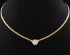<span class='ref_item'>120 -</span>  <span class="object_title">GARGANTILLA EN ORO DE 18KT Y DIAMANTES</span><br><span class="technical_description">Gargantilla realizada en oro bicolor de 18kt. colgante compuesto por diamante central y orla de diamantes engastados en grano con un peso total aprox  0.25 ct.</span>  