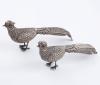 <span class='ref_item'>298 -</span> <span class="object_title">PAREJA DE FAISANES DE PLATA</span>  <p><span class="technical_description">Pareja de faisanes realizados en plata de ley.<br/>Faltan tres de las aplicaciones de los ojos.<br/>Con contrastes.</span><br>Peso: <span class="PESO_HCES1">61,50</span> <span class="PESOUMED_HCES1">gr.</span><br></p>