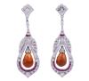 <span class='ref_item'>80 -</span> <span class="description">PENDIENTES EN ORO 18KT, RUBÍES, CITRINOS Y DIAMANTES</span>  <p><span class="description">Pendientes estilo Art Déco realizados en oro de 18kt. Con rubíes en talla galería engastados en carril, con un peso total aprox de 0.10ct y diamantes en talla brillante, engastados en grano, con un peso total aprox de 0.70ct. En el centro cuelgan cuarzos citrinos en talla briolette, con un peso total aprox de 0.39ct Cierre: Presión Longitud: 4,5cm Peso: 9,80 gr.</span></p>