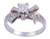 <span class='ref_item'>186 -</span> <span class="description">SORTIJA EN ORO 18KT Y DIAMANTES</span>  <p><span class="description">Sortija realizada en oro de 18kt con un diamante central talla brillante engastado en garras de aprox 0.38ct y motivo de lazada cuajada de brillantes engastados en grano y garras con un peso aprox de 0.25ct Medida Sortija: 12 Peso: 3,70 gr.</span></p>