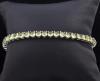 <span class='ref_item'>192 -</span> <span class="object_title">BRAZALETE EN PLATA VERMEIL</span>  <p><span class="technical_description">Brazalete realizado en plata 925 vermeil con cabujones de peridotos engastados en garras. <br/>Cierre: Pestaña y ochos de seguridad.<br/>Longitud: 18cm</span><br>Peso: <span class="PESO_HCES1">17</span> <span class="PESOUMED_HCES1">gr.</span><br></p>