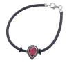 <span class='ref_item'>33 -</span> <span class="object_title">PULSERA EN PLATA DE LEY, CAUCHO NEGRO, ESPINELAS NEGRAS Y PIEDRA ROJA</span>  <p><span class="technical_description">Pulsera realizada en caucho negro con eslabón central en plata de ley, con contrastes. Adornado con una piedra roja central, orlada por espinelas negras.<br/>Cierre: Mosquetón<br/>Longitud: 18cm</span><br>Peso: <span class="PESO_HCES1">6,10</span> <span class="PESOUMED_HCES1">gr.</span><br></p>