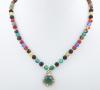 <span class='ref_item'>35 -</span> <span class="object_title">COLLAR DE CUARZOS BRILLANTES Y ORO DE 18KT</span>  <p><span class="technical_description">Collar corto compuesto por un colgante talla esférica de cuarzo verde rodeado por orla en forma de pétalos con brillantes y tallas esféricas de diferentes colores de cuarzo, adornadas por cuentas de oro de 18kt. Cierre de oro de 18kt con pestaña.<br/>Longitud. 40cm</span><br>Peso: <span class="PESO_HCES1">26,60</span> <span class="PESOUMED_HCES1">gr.</span><br></p>