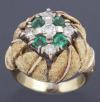 <span class='ref_item'>154 -</span> <span class="object_title">SORTIJA DE ORO DE 18KT, ESMERALDAS Y DIAMANTES</span>  <p><span class="technical_description">Sortija realizada en oro de 18kt con el frente en mate adornado de 4 esmeraldas en talla redonda con un peso total aprox. de 0,50ct y brillantes con un peso total aprox. de 0,70ct<br/>Medida sortija: 10</span><br>Peso: <span class="PESO_HCES1">14,90</span> <span class="PESOUMED_HCES1">gr.</span><br></p>