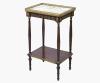 <span class='ref_item'>189 -</span> <span class="description">MESA AUXILIAR ESTILO NAPOLEÓN III </span>  <p><span class="description">Mesa auxiliar en madera de caoba, bronce repujado y mármol con vetas marrones. Decorada con detalles en bronce en los bordes de la tabla inferior que imitan las cortinas de un telón, en sus cuatro patas torneadas y en el cuerpo que sustenta la superficie superior, con unos elementos vegetales. Mantiene intacta la barandilla perforada en bronce que remata la mesa.<br>76,50 cm.x45,50 cm.x33 cm.</span></p>