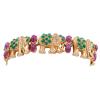 <span class='ref_item'>218 -</span> <span class="object_title">PULSERA EN ORO 18KT, RUBÍES, ESMERALDAS Y DIAMANTES</span>  <p><span class="technical_description">Pulsera semirrígida realizada en oro de 18kt. Formada por figuras de elefantes cuajados de esmeraldas en cabujón redondo con peso total aprox 5.88ct, diamantes en talla brillante con peso total aprox 0.53ct y rubíes en talla cabujón oval con peso total aprox 9.10ct.<br/>Cierre: Caja con lengüeta<br/>Longitud: 18cm</span><br>Peso: <span class="PESO_HCES1">50,90</span> <span class="PESOUMED_HCES1">gr.</span><br></p>