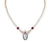 <span class='ref_item'>200 -</span> <span class="object_title">COLLAR EN ORO BICOLOR 18KT, PERLAS CULTIVADAS, RUBÍES, AGUAMARINA Y DIAMANTES</span>  <p><span class="technical_description">Collar realizado en oro bicolor de 18kt formado por perlas cultivadas, calibradas en 6,10-6,45mm. Colgante central con una perla color tahití en cabujón perilla, acompañada de dos rubíes en talla redonda cabujón, con peso total aprox 4.80ct, y un diamante central en talla brillante con peso aprox 0.25ct. En el cierre una aguamarina en talla esmeralda rectangular, con peso aprox 2.80ct, flanqueada por dos hileras de brillantes con peso total aprox 0.04ct. <br/>Cierre: Caja con lengüeta y ocho de seguridad<br/>Longitud: 57 cm</span><br>Peso: <span class="PESO_HCES1">40,60</span> <span class="PESOUMED_HCES1">gr.</span><br></p>