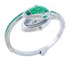 <span class='ref_item'>63 -</span> <span class="object_title">RELOJ DE PULSERA EN METAL PLATEADO, CRISTALES VERDES E INCOLOROS. CUARZO</span>  <p><span class="technical_description">Reloj de pulsera en metal plateado de la marca Cussi, con movimiento de cuarzo. Con forma de serpiente cuajada por cristales verdes en tallas marquise, baguette y trapecio, y cristales incoloros en talla brillante. Debajo de la cabeza de la serpiente se encuentra la esfera del reloj. Brazalete abierto semirrígido. En estado de marcha.<br/>Diámetro: 7cm</span><br>Peso: <span class="PESO_HCES1">46,40</span> <span class="PESOUMED_HCES1">gr.</span><br></p>