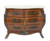 <span class='ref_item'>242 -</span> <span class="object_title">CÓMODA BOMBÉ ESTILO LUIS XV EN MADERA DE NOGAL, S.XX</span>   <p><span class="technical_description">Realizada en marquetería y rematada por tapa de mármol veteado en tonos grises y anaranjados. Apliques de bronce dorado conforman los tiradores, bocallaves y relieves decorativos, destacando en cada uno de los laterales delanteros la figura de una niña en un asiento que se extiende hasta las patas a modo de formas vegetales. Cuerpo constituido por tres amplios cajones, acompañados de tres llaves.<br/>Presenta oxidación </span><br><span class="ALTO_HCES1">82</span>x<span class="ANCHO_HCES1">102</span>x<span class="GRUESO_HCES1">42 </span><span class="GRUESOUMED_HCES1">cm.</span></p>