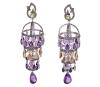 <span class='ref_item'>24 -</span> <span class="object_title">PENDIENTES EN PLATA DE LEY, PERIDOTOS, CITRINOS, AMATISTAS Y DIAMANTES</span>  <p><span class="technical_description">Pareja de pendientes realizados en plata de ley, con contraste. De inspiración bizantina, largos y con movimiento. En la parte superior peridotos en talla redonda, engastados en chatón. Bajo ellos, tres cuerpos colgantes con tallas móviles de amatistas y citrinos en talla perilla engastados en bisel. El conjunto rematado por una talla perilla de amatista y adornado con diamantes en talla antigua engastados en grano con un peso total aprox de 3.60ct.<br/>Cierre: Presión<br/>Longitud: 9cm</span><br>Peso: <span class="PESO_HCES1">33,80</span> <span class="PESOUMED_HCES1">gr.</span><br></p>