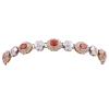 <span class='ref_item'>134 -</span> <span class="object_title">PULSERA EN ORO BICOLOR 18KT, ZAFIROS ORANGE Y DIAMANTES</span>  <p><span class="technical_description">Pulsera realizada en oro bicolor de 18kt. Eslabones formados por rosetas con zafiros orange centrales en talla oval, engastados en bisel, con peso total aprox de 4.50ct. Diamantes en orla y en eslabones en forma de flor, en talla brillante, engastados en grano y chatón, con un peso total aprox de 1.25ct. <br/>Cierre: Caja con lengüeta y doble ocho de seguridad<br/>Longitud: 18cm</span><br>Peso: <span class="PESO_HCES1">19,30</span> <span class="PESOUMED_HCES1">gr.</span><br></p>