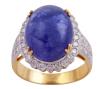 <span class='ref_item'>20 -</span> <span class="description">SORTIJA EN ORO BICOLOR 18KT, TANZANITA Y DIAMANTES</span>  <p><span class="description">Sortija realizada en oro bicolor de 18kt con cabujón de tanzanita, engastada en garras, con peso total aprox de 10ct. En orla y hombros diamantes en talla brillante, engastados en grano sobre vistas en blanco, con un peso total aprox de 0.40ct Medida Sortija: 12 Peso: 6,50 gr.</span></p>