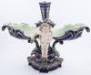 <span class='ref_item'>154 -</span> <span class="object_title">CENTRO DE MESA DE PORCELANA POLICROMADA </span>   <p><span class="technical_description">Centro de mesa tipo doble realizado en porcelana policromada en azul marino, decorado con dos angelotes. Presenta restauraciones en la cabeza de la figura y en uno de los laterales del cuenco.</span><br><span class="ALTO_HCES1">38 </span><span class="ALTOUMED_HCES1">cm.</span>x<span class="ANCHO_HCES1">47 </span><span class="ANCHOUMED_HCES1">cm.</span>x<span class="GRUESO_HCES1">24 </span><span class="GRUESOUMED_HCES1">cm.</span></p>