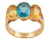 <span class='ref_item'>19 -</span> <span class="object_title">SORTIJA EN ORO 18KT, APATITO, BERILOS Y RUBÍES</span>  <p><span class="technical_description">Sortija realizada en oro de 18kt con apatito azul con peso aprox 2ct y a los lados berilos heliodoro con peso total aprox 3ct, todos en talla oval engastados en bisel abierto. En hombros rubíes en talla cuadra, engastados en bisel, con peso total aprox 0.15ct<br/>Medida Sortija: 12</span><br>Peso: <span class="PESO_HCES1">5,70</span> <span class="PESOUMED_HCES1">gr.</span><br></p>