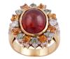 <span class='ref_item'>166 -</span> <span class="object_title">SORTIJA EN ORO BICOLOR 18KT, ESPESARTINA, ZAFIROS Y DIAMANTES</span>  <p><span class="technical_description">Sortija realizada en oro bicolor de 18kt con granate espesartina en cabujón oval engastada en bisel con peso aprox 6.50ct. Con orla de zafiros fancy dorados y verdes todos en talla redonda engastados en garras con peso total aprox 1.60ct. Adorno de diamantes en talla brillante, engastados en garras y grano con un peso total aprox de 0.25ct<br/>Medida Sortija: 12</span><br>Peso: <span class="PESO_HCES1">13,60</span> <span class="PESOUMED_HCES1">gr.</span><br></p>