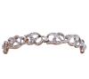 <span class='ref_item'>173 -</span> <span class="object_title">PULSERA VINTAGE EN ORO BICOLOR 18KT Y DIAMANTES</span>  <p><span class="technical_description">Pulsera vintage realizada en oro bicolor de 18kt. Formada por eslabones de bandas onduladas cuajadas de diamantes en talla rosa sobre vistas en blanco con peso total aprox 1.50ct. <br/>Cierre: Lengüeta y cadena de seguridad<br/>Longitud: 18cm</span><br>Peso: <span class="PESO_HCES1">24</span> <span class="PESOUMED_HCES1">gr.</span><br></p>