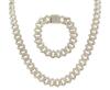 <span class='ref_item'>94 -</span> <span class="object_title">CONJUNTO DE COLLAR Y PULSERA EN METAL CHAPADO EN ORO Y CIRCONITAS</span>  <p><span class="technical_description">Conjunto de collar y pulsera realizados en metal chapado en oro con eslabones cubanos cuajados de circonitas, también los broches.<br/>Cierre: Caja con reasa y mecanismo de seguridad<br/>Longitud: 60cm el collar, 18cm la pulsera</span><br>Peso: <span class="PESO_HCES1">120,40</span> <span class="PESOUMED_HCES1">gr.</span><br></p>