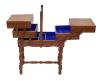 <span class='ref_item'>217 -</span> <span class="object_title">MUEBLE COSTURERO</span>   <p><span class="technical_description">Con compartimentos interiores forrados en terciopelo azul. Deterioros madera por el paso del tiempo.<br/>Medidas: 77cm alto, 50cm de ancho cerrado y 142cm abierto, 27cm de fondo</span><br></p>