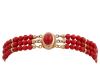 <span class='ref_item'>3 -</span> <span class="object_title">PULSERA EN ORO 18KT Y CORAL</span>  <p><span class="technical_description">Pulsera con pasadores y cierre realizados en oro de 18kt. Compuesta por tres hilos de cuentas esféricas de coral rojo y placa de coral en broche.<br/>Cierre: Caja con lengüeta<br/>Longitud: 17cm</span><br>Peso: <span class="PESO_HCES1">12,50</span> <span class="PESOUMED_HCES1">gr.</span><br></p>