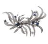 <span class='ref_item'>10 -</span> <span class="object_title">BROCHE EN ORO 18KT, ZAFIROS Y DIAMANTES</span>  <p><span class="technical_description">Broche realizado en oro de 18kt. Diseño vegetal adornado por zafiros en talla redonda con peso total aprox 0.65ct y diamantes en talla brillante con un peso aprox 0.60ct<br/>Cierre: Aguja con mecanismo de seguridad<br/>Medidas: 7 x 4,5cm</span><br>Peso: <span class="PESO_HCES1">17,60</span> <span class="PESOUMED_HCES1">gr.</span><br></p>