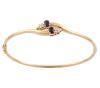 <span class='ref_item'>248 -</span> <span class="object_title">PULSERA RÍGIDA EN ORO 18KT, ZAFIROS Y DIAMANTES</span>  <p><span class="technical_description">Pulsera rígida oval realizada en oro de 18kt, con bisagra. Centro adornado por dos zafiros en talla oval con peso total aprox 0.60ct y diamantes en talla brillante con peso total aprox 0.40ct<br/>Cierre: Caja con lengüeta y ocho de seguridad<br/>Medida oval interior: 6,3cm</span><br>Peso: <span class="PESO_HCES1">9,10</span> <span class="PESOUMED_HCES1">gr.</span><br></p>