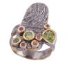 <span class='ref_item'>214 -</span> <span class="object_title">SORTIJA EN PLATA 925 CON CHAPADO EN ORO, PERIDOTOS Y ZAFIROS DORADOS. JOYERÍA DE AUTOR, PIEZA ÚNICA</span>  <p><span class="technical_description">Sortija realizada en plata de ley 925 con contraste y partes chapadas en oro. Peridotos en talla perilla y redonda con peso total aprox 0.75ct y zafiros dorados con peso total aprox 0.06ct<br/>Medida Sortija: 16</span><br>Peso: <span class="PESO_HCES1">8,60</span> <span class="PESOUMED_HCES1">gr.</span><br></p>