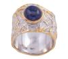 <span class='ref_item'>145 -</span> <span class="object_title">SORTIJA EN PLATA 925 CON CHAPADO EN ORO Y ZAFIRO. JOYERÍA DE AUTOR, PIEZA ÚNICA</span>  <p><span class="technical_description">Sortija realizada en plata de ley 925 con contraste y partes chapadas en oro. Ancha de terminación rugosa adornada por un zafiro en cabujón oval con peso aprox 2ct<br/>Medida Sortija: 15</span><br>Peso: <span class="PESO_HCES1">12,80</span> <span class="PESOUMED_HCES1">gr.</span><br></p>