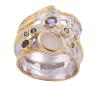 <span class='ref_item'>263 -</span> <span class="object_title">SORTIJA EN PLATA 925 CON CHAPADO EN ORO, CUARZO CRISTAL EN BRUTO, TANZANITA Y ZAFIROS. JOYERÍA DE AUTOR, PIEZA ÚNICA</span>  <p><span class="technical_description">Sortija realizada en plata de ley 925 con contraste y partes chapadas en oro. Ancha con un cuarzo cristal blanco en bruto, tanzanita en talla oval con peso aprox 0.16ct y zafiros en talla redonda con peso total aprox 0.10ct<br/>Medida Sortija: 13</span><br>Peso: <span class="PESO_HCES1">8</span> <span class="PESOUMED_HCES1">gr.</span><br></p>