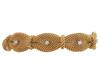 <span class='ref_item'>203 -</span> <span class="object_title">PULSERA EN ORO 18KT Y DIAMANTES</span>  <p><span class="technical_description">Pulsera realizada en malla tejida en oro de 18kt, años 50. Adornada con 6 diamantes en talla brillante, engastados en garra, con peso total aprox 0.70ct. <br/>Cierre: Caja con lengüeta con cadena y ocho de seguridad<br/>Longitud: 18cm</span><br>Peso: <span class="PESO_HCES1">65</span> <span class="PESOUMED_HCES1">gr.</span><br></p>
