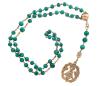 <span class='ref_item'>105 -</span> <span class="object_title">ROSARIO EN PLATA 925 CHAPADA EN ORO Y MALAQUITA, S.XIX</span>  <p><span class="technical_description">Rosario realizado en plata de ley 925 chapada en oro, siglo XIX. Formado por cuentas esféricas de malaquita, una bola lobulada, apliques con tornapuntas y medalla colgante con imagen de la Virgen con orla vegetal e inscripción posterior "TNSDNVA". Una de las cuentas de malaquita con desperfectos.<br/>Longitud: 60cm</span><br>Peso: <span class="PESO_HCES1">96,50</span><br></p>