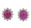 <span class='ref_item'>69 -</span> <span class="object_title">PENDIENTES EN ORO 18KT, RUBÍES Y DIAMANTES</span>  <p><span class="technical_description">Pareja de pendientes realizados en oro de 18kt. Diseño de roseta con rubíes en cabujón oval de peso total aprox 4ct y orla de diamantes en talla brillante con peso total aprox 1.10ct. <br/>Cierre: Omega</span><br>Peso: <span class="PESO_HCES1">7,40</span> <span class="PESOUMED_HCES1">gr.</span><br></p>