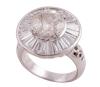 <span class='ref_item'>80 -</span> <span class="object_title">SORTIJA EN PLATINO Y DIAMANTES</span>  <p><span class="technical_description">Sortija realizada en platino. Con un diamante central en talla brillante, con peso aprox 3.24ct, estimación de color K y de pureza P3. Orla de 24 diamantes en talla trapecio, con peso total aprox 3.58ct, estimación de color I y de pureza VS. En caja de engaste 11 diamantes fancy yellow brown en talla brillante con peso total aprox 0.11ct.<br/>Peso total aprox de todos los diamantes: 6.93ct<br/>Se acompaña de copia del informe gemológico de Mllopis Nº 2760-J-200-A4-13275-23<br/>Medida Sortija: 12</span><br>Peso: <span class="PESO_HCES1">17</span> <span class="PESOUMED_HCES1">gr.</span><br></p>