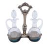 <span class='ref_item'>250 -</span> <span class="object_title">VINAGRERAS CON BASE EN PLATA</span>   <p><span class="technical_description">Pareja de vinagreras en vidrio tallado sobre soporte en plata repujada. Con contraste. Con tapas de cristal.<br/>Peso neto plata: 109,4gr<br/>Peso bruto: 864,6gr</span><br></p>
