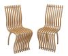<span class='ref_item'>218 -</span> <span class="object_title">PAREJA DE SILLAS "SCHIZZO CHAIR", MARCA VITRA (SUIZA, 1989)</span>   <p><span class="author">RON ARAD (Israel, 1958)</span> <br><span class="technical_description">Realizadas en haya laminada, latón cromado, aluminio. Importante diseño que permite ensamblar ambas sillas con su estructura curvada.<br/>En perfecto estado.<br/>Medidas: 90x35x44cm</span><br></p>