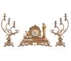 <span class='ref_item'>170 -</span> <span class="object_title">GUARNICIÓN RELOJ SOBREMESA Y PAREJA DE CANDELABROS, AÑOS 60</span>   <p><span class="technical_description">Reloj de sobremesa realizado en metal dorado sobre base de mármol marrón veteada. Decorado con figura femenina y niño con rama de vid.<br/>Esfera en metal dorado con número romanos. Sobre patas de metal dorado repujado.<br/>En funcionamiento. Con llave.<br/>Medidas: 45x28x16cm<br/>Pareja de candelabros en metal dorado para tres velas. <br/>Medidas: 43x23cm</span><br></p>