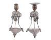 <span class='ref_item'>253 -</span> <span class="object_title">PAREJA DE CANDELABROS EN PLATA DE LEY</span>  <p><span class="technical_description">Pareja pequeños candelabros realizados en plata de ley 925, con contrastes. Los portavelas están sobre esferas elevadas por patas apoyadas en una base. Presenta deterioros y falta uno de los platillos<br/>Altura: 21cm<br/>Peso: 505,8gr</span><br></p>