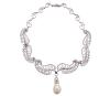<span class='ref_item'>11 -</span> <span class="object_title">GARGANTILLA ESTILO ART NOUVEAU EN ORO 18KT CON IMPORTANTE PERLA AUSTRALIANA BARROCA Y DIAMANTES </span>  <p><span class="technical_description">Gargantilla realizada en oro de 18kt. Formada por bellos motivos sinuosos calados y cuajados compuesto de 296 brillantes engastados en garras. Hilera central de diamantes en talla baguette engastados en carril, con centro del que pende una importante perla australiana barroca desmontable de gran perfección calibrada aprox en 25 x 17mm<br/>Peso total aprox de los diamantes: 10.70ct</span><br>Peso: <span class="PESO_HCES1">85,40</span> <span class="PESOUMED_HCES1">gr.</span><br></p>